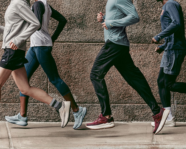 Medium shot of a group of runners wearing Brooks