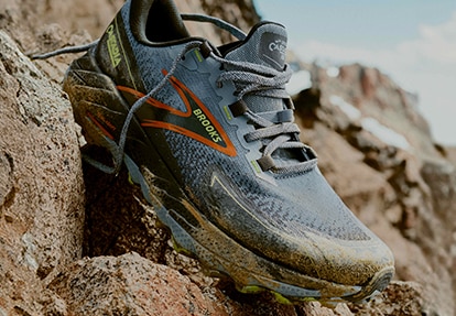 A Brooks shoe on rocky terrain
