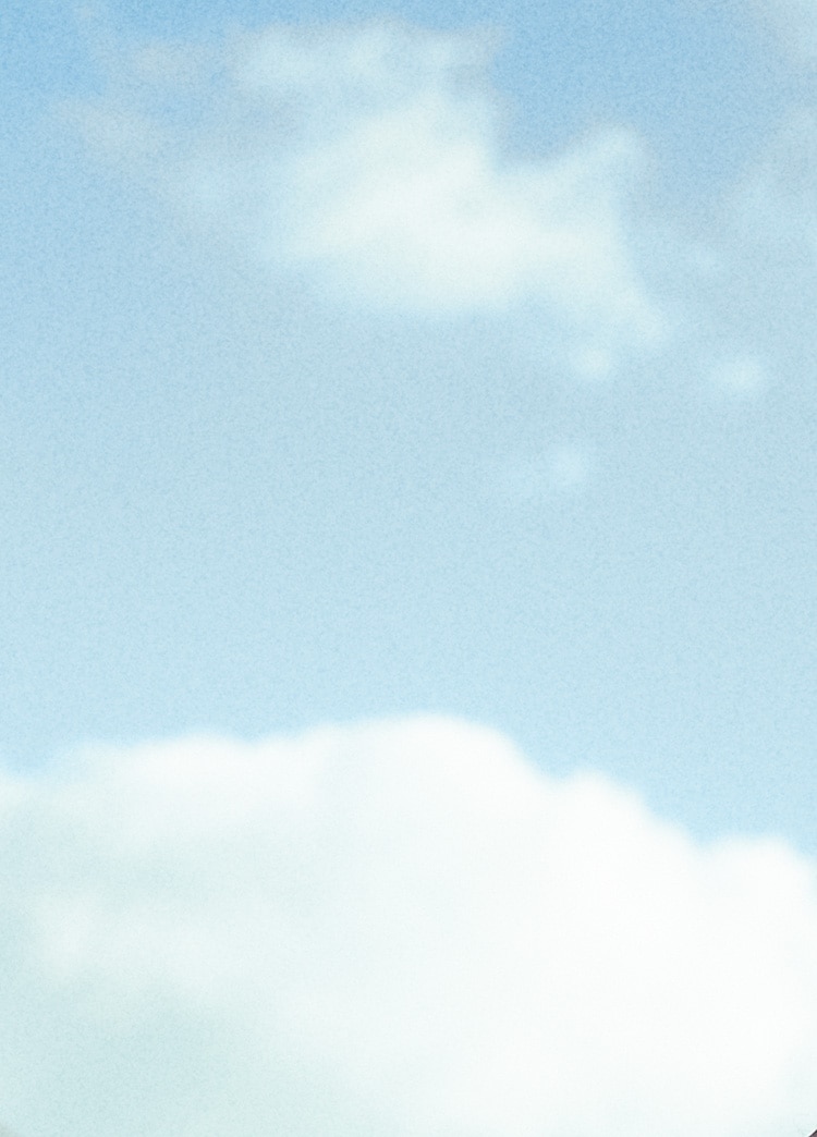 A light blue sky with white clouds