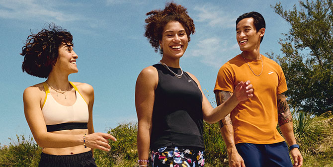 Three people walking in Brooks gear