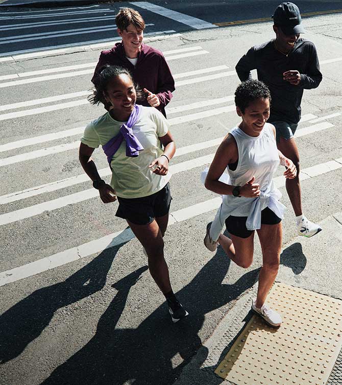 A group of people running in Brooks apparel