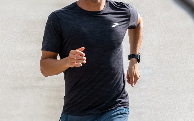 Close-up shot of a man wearing the Luxe shirt from Brooks Running