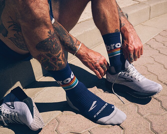 Runner putting on his shoes