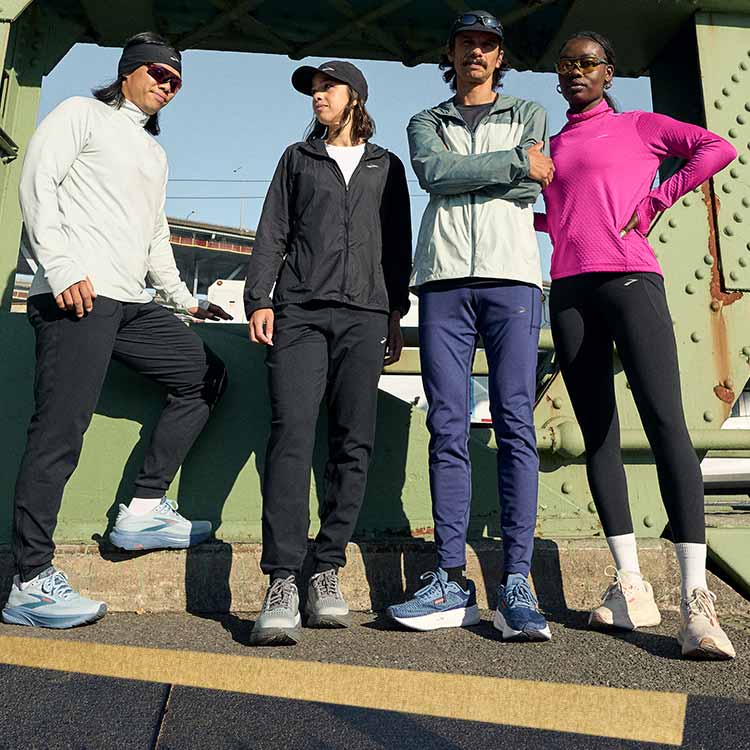 Four runners wearing Brooks gear