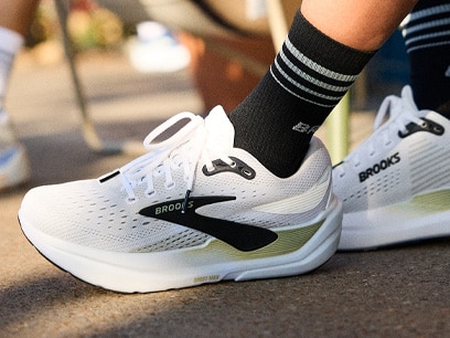 A person wearing Brooks shoes