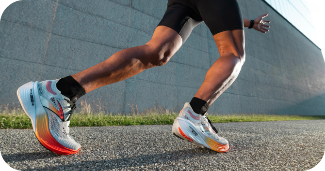 Low angle shot of a man running and wearing the Hyperion Elite running shoes.