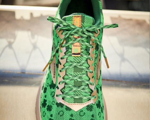A green shoe with shamrocks from above