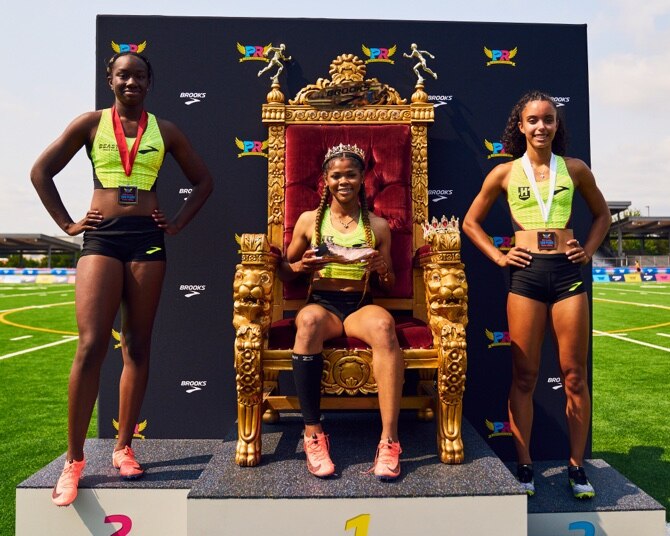 1st place runner sitting in a throne