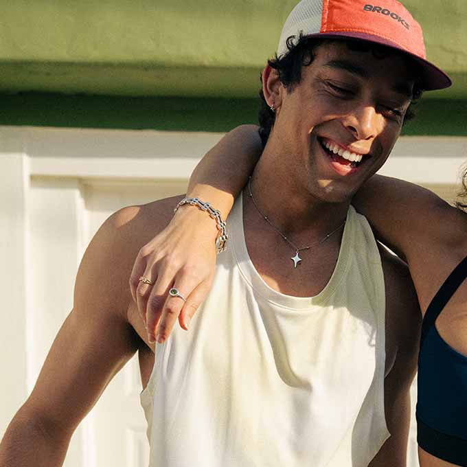 A man smiling in Brooks gear