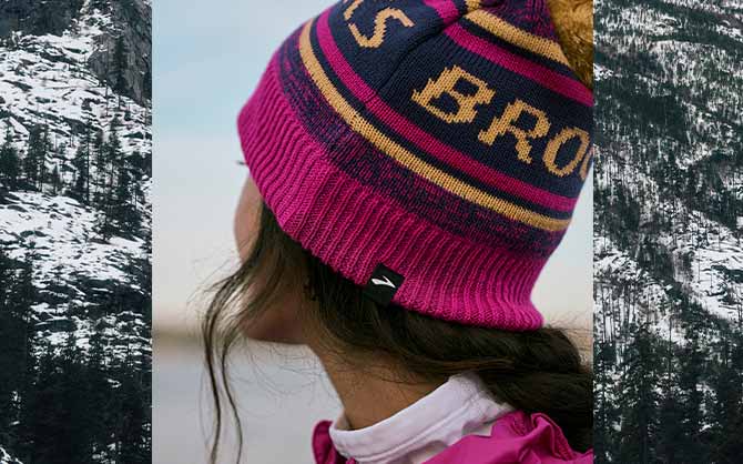 Woman wearing a Brooks beanie
