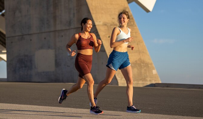 Two girls running with Brooks shoes