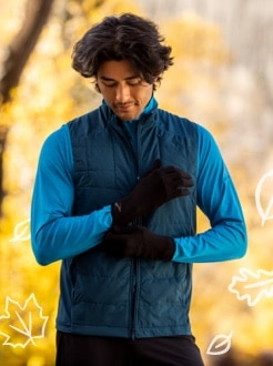 Runner putting gloves on with Fall background