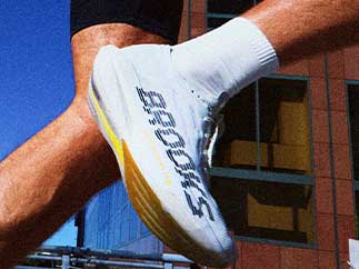 A closeup of a man wearing Brooks shoes
