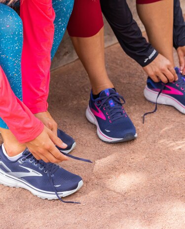 Runners tying the laces of their running shoes