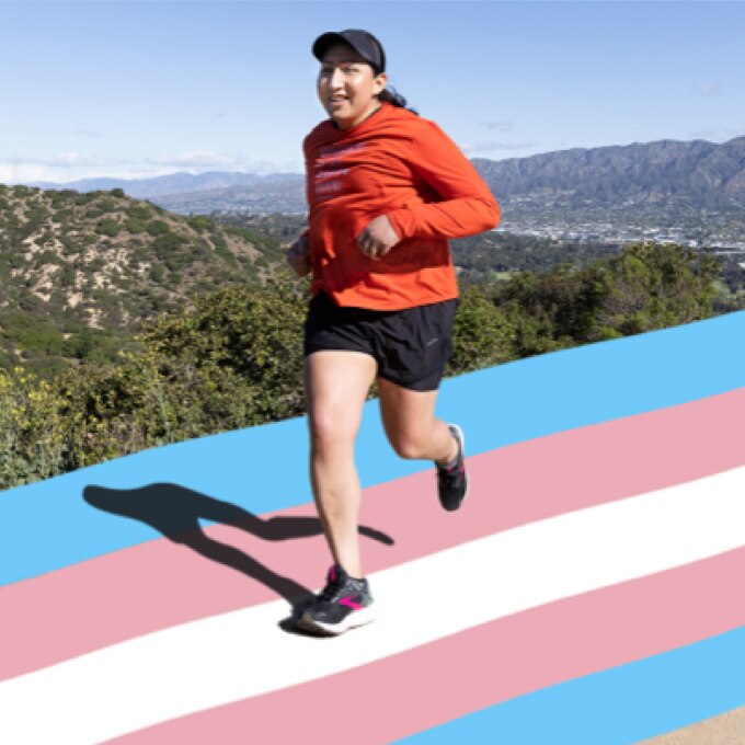 Un runner transgenre sur une piste aux couleurs transgenre