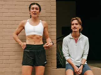 Two people wearing Brooks apparel