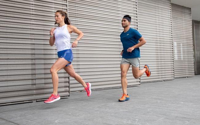 Two runners on the side of a building