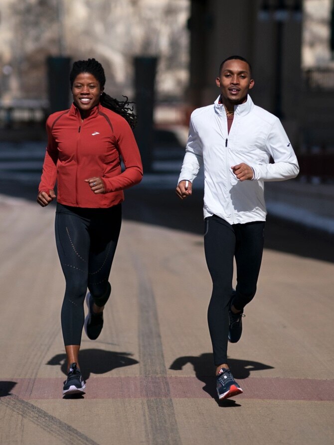 Two models running with Fusion Hybrid jackets