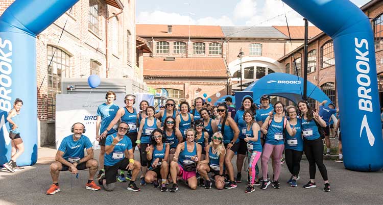 A group of people pose for a picture outside