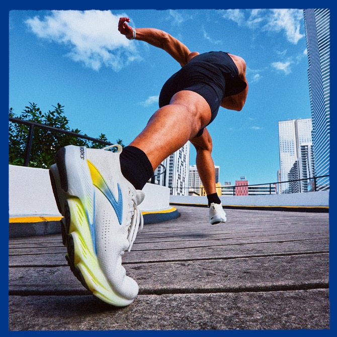 A person wearing Brooks shoes in stride