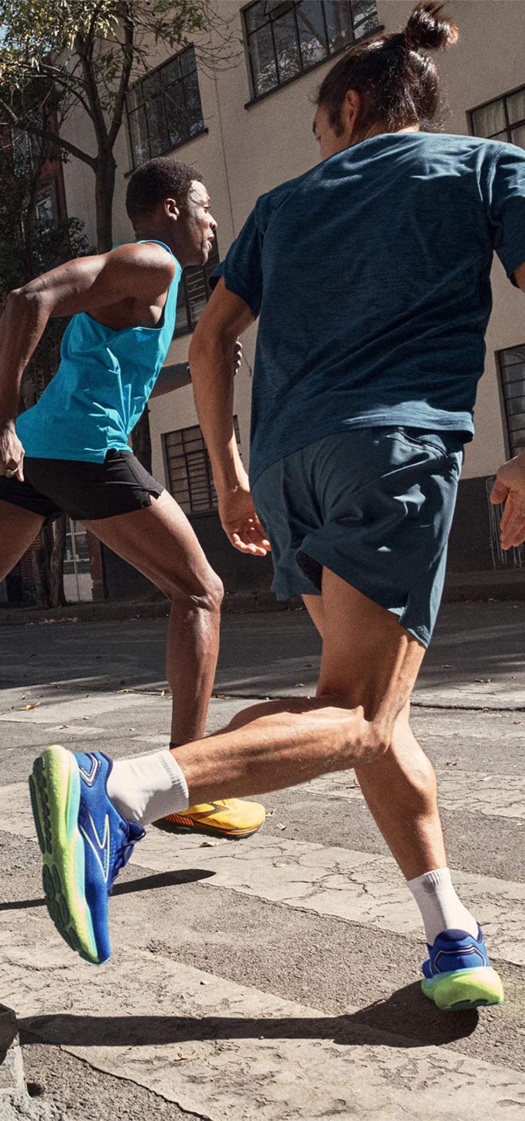 Runners celebrating the run with a fist bump