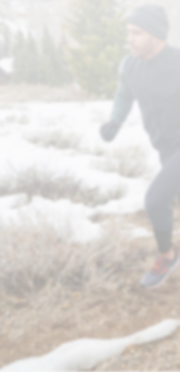 Man running up trail hill