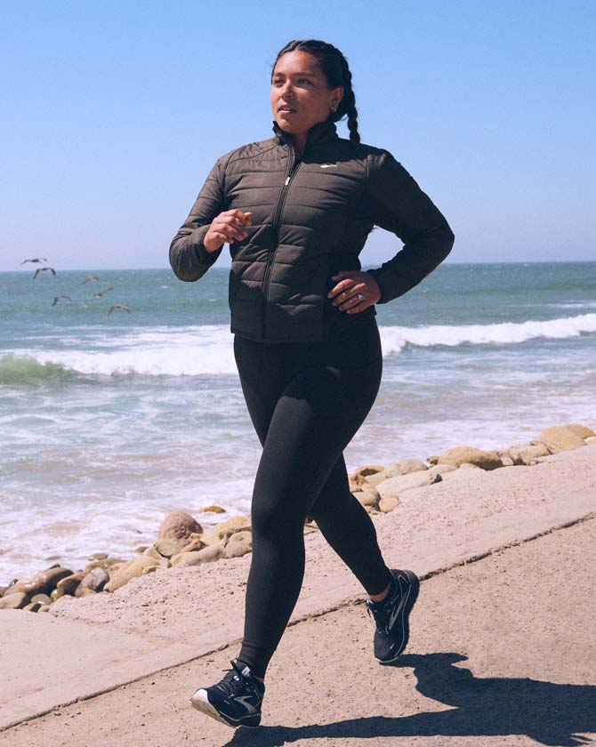 Model wearing Brooks Shield jacket
