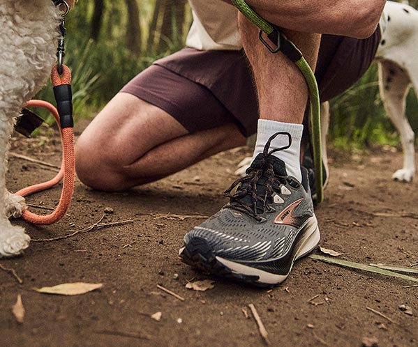 A person wearing men's Brooks shoes outdoors
