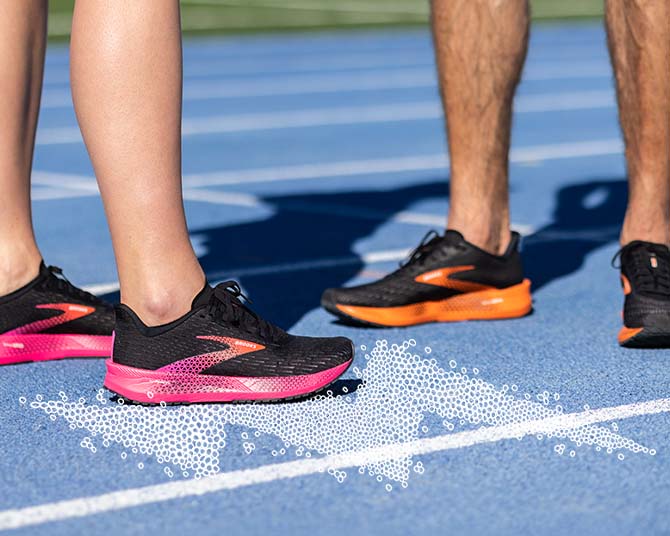 Close up view of runner shoes on a track
