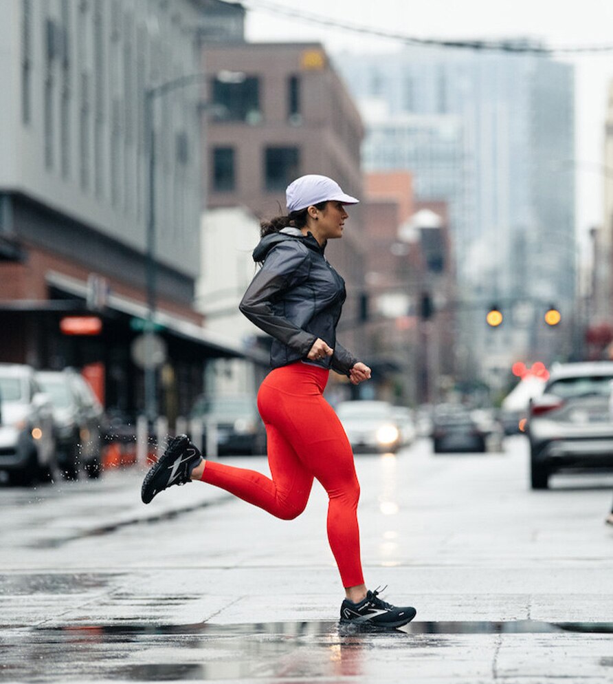 Woman running in rainy conditions.