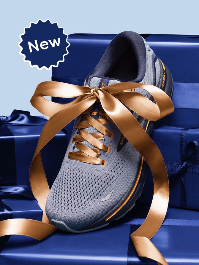 A gray running shoe with a bow on it