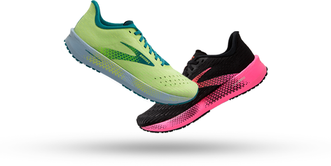 Green and black and pink running shoes