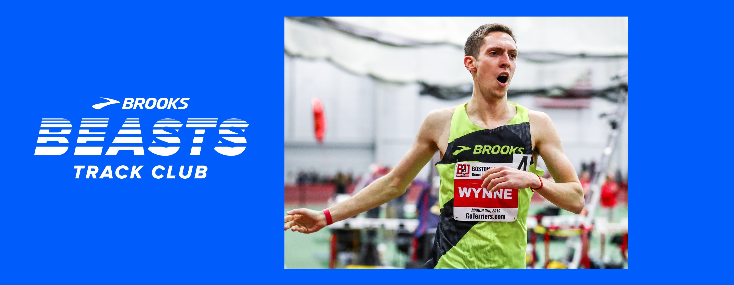 Brooks pro runner Henry Wynne celebrates finishing his race during an indoor track meet.