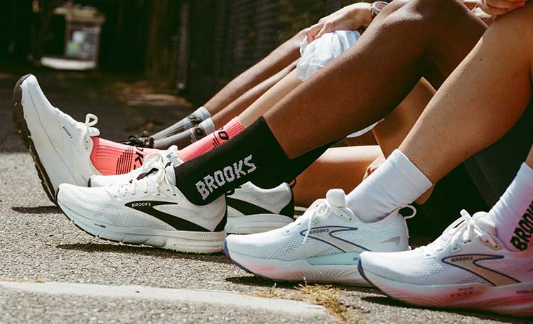People wearing Brooks shoes on a sunny day