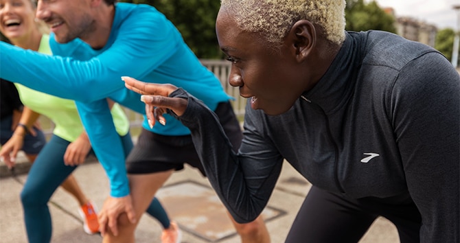 Close-up shot of runners looking at a direction