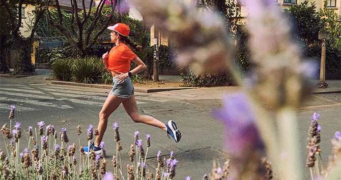Long shot of a woman running on the road
