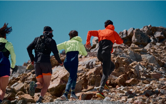 Three runners side by side on concrete path