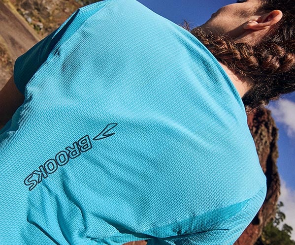 A person wearing women's Brooks apparel
