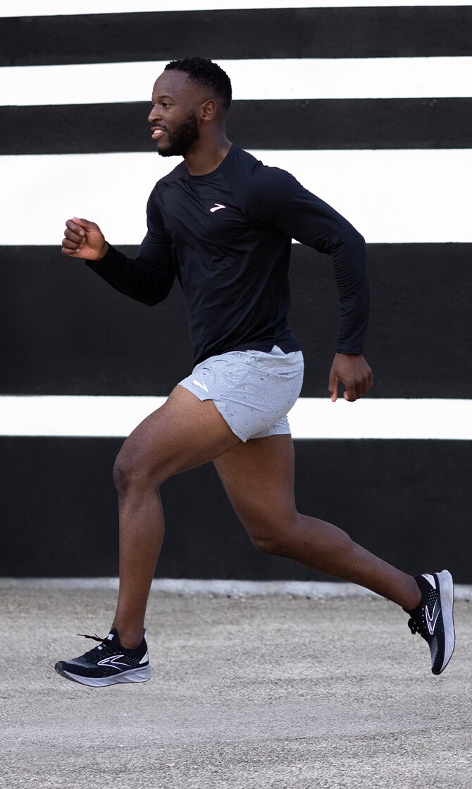 Model with Sherpa shorts running