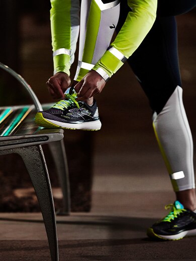 A runner geared up in the Brooks Run Visible collection