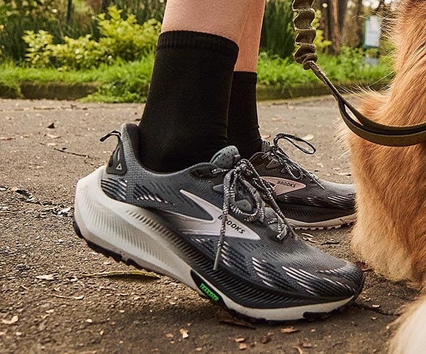 A person wearing women's Brooks shoes