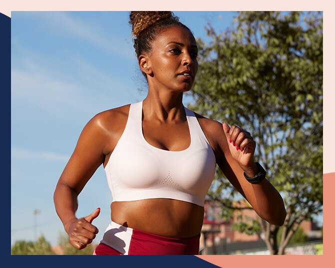 Women with white run bra running on a sunny day