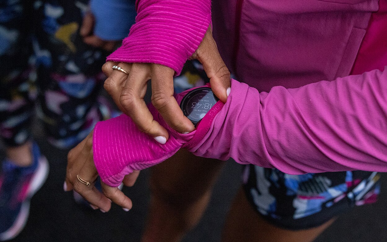 Runner adjusting their watch