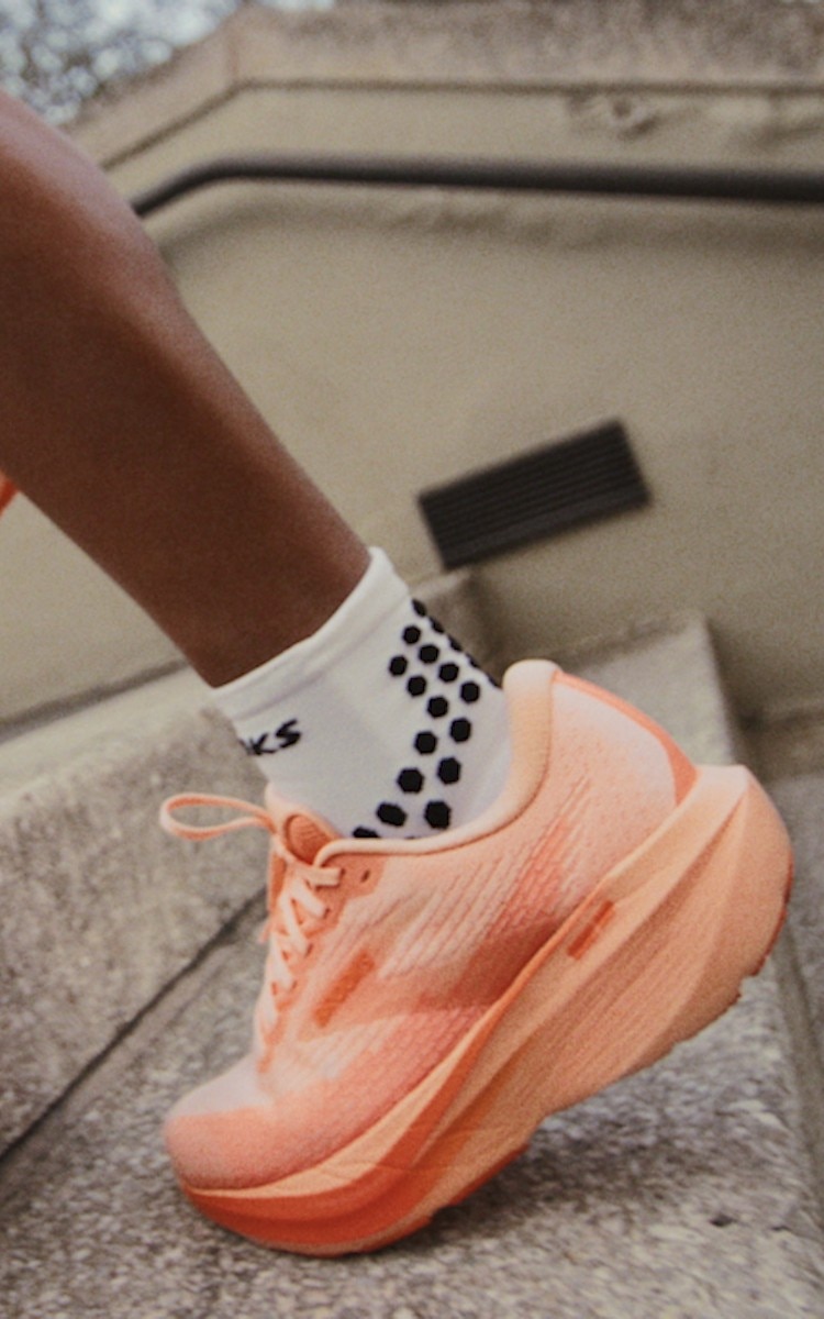 A person wearing the Ghost Amp running outside