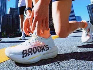 A closeup of a woman wearing Brooks shoes