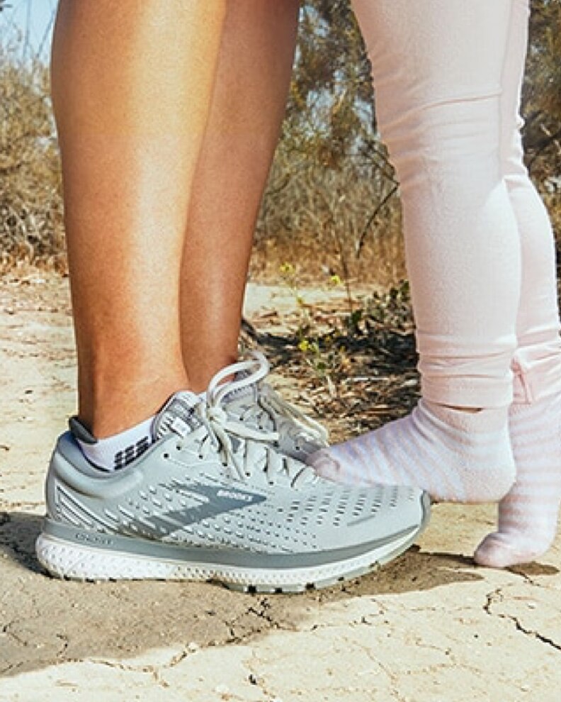 Mother wearing Brooks with daughter
