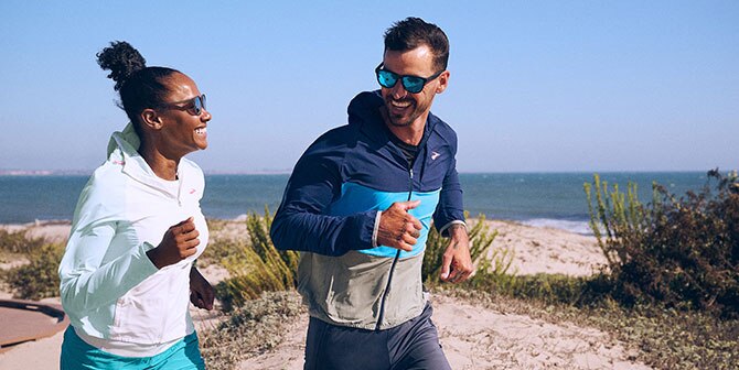 Two runners wearing the Brooks Canopy Jacket.