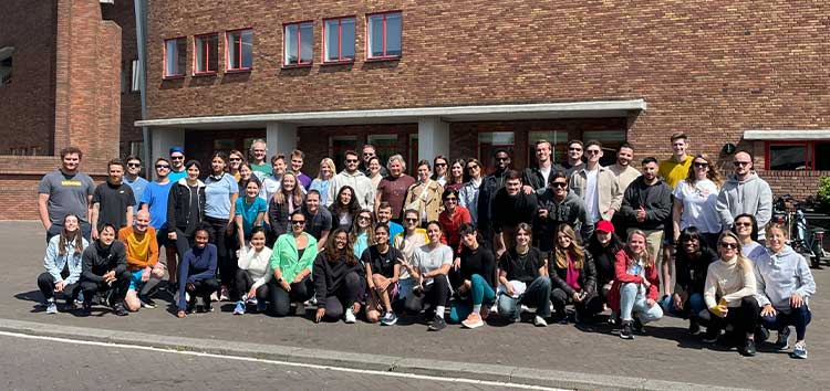 Brooks employees standing in front of a building