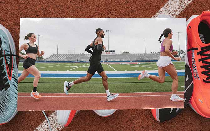 Three people run on a track