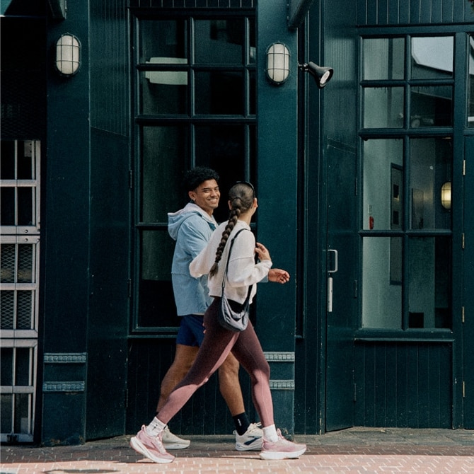 brooks runners chatting in the city